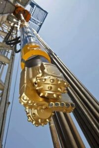 Downhole Motor and a Tricone Rock Bit